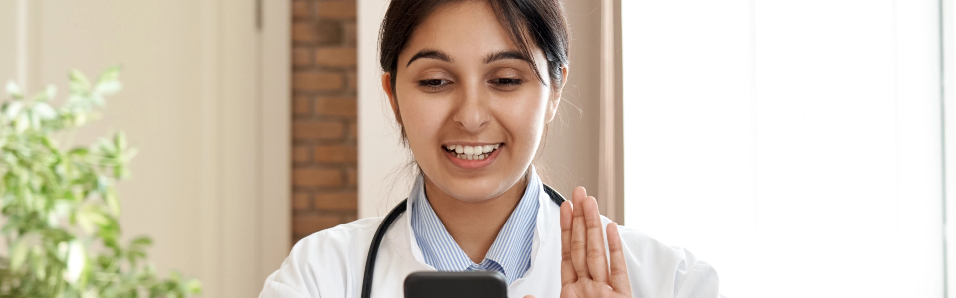 doctor talking to her patient on phone